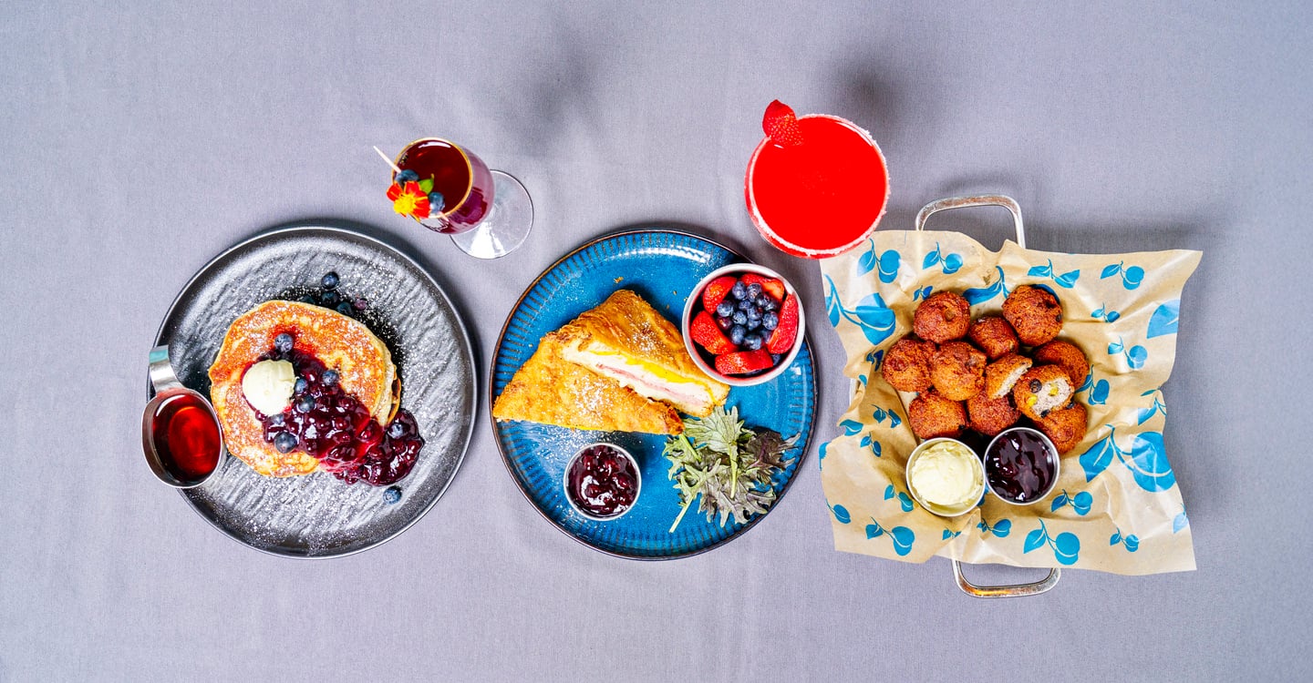 A spread of sweet and savory brunch plates at Blueberry's Grill